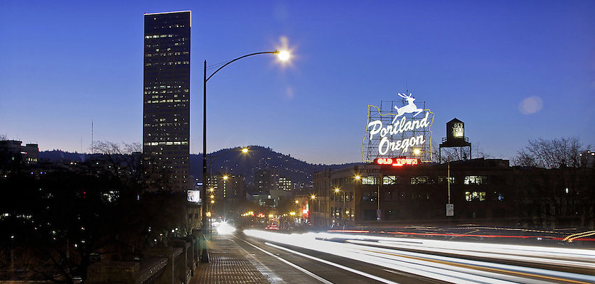 139 - PORTLAND, OR - JANUARY 20, 2013 - Vehicle lights create light streaks over the Burnside Bridge with Old Town Portland Oregon sign on the back at dusk, January 20, 2013.;  (Photo by Ricardo DeAratanha/Los Angeles Times via Getty Images)